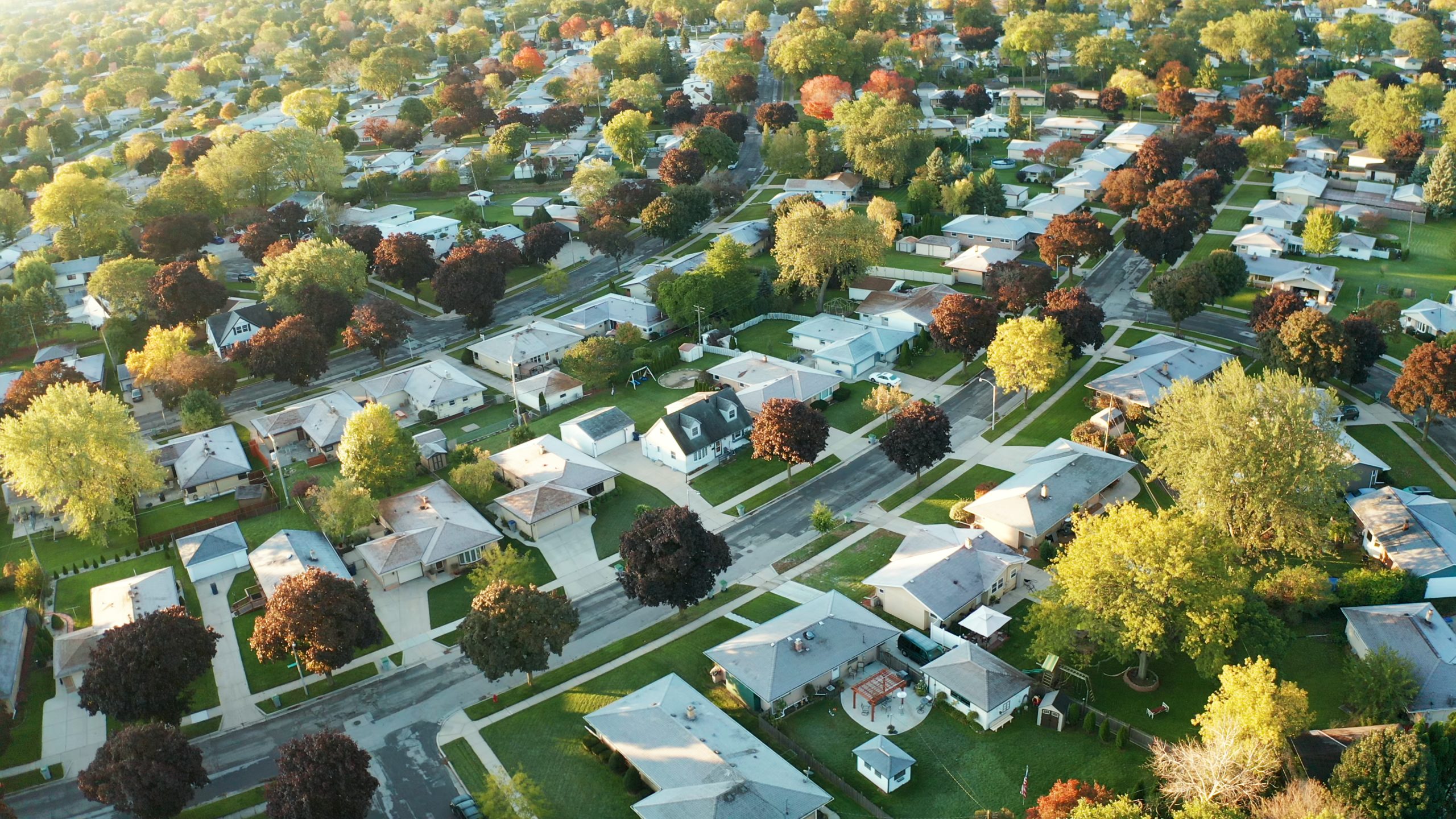 Aerial view of American suburban neighborhood with houses and yards